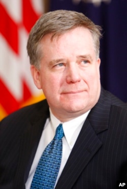 FILE - Dennis Wilder, then the senior director for East Asian affairs at the National Security Council, is pictured in the Roosevelt Room of the White House in Washington, Dec. 10, 2007.