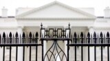 FILE - The White House is visible through the fence at the North Lawn in Washington, on June 16, 2016. A driver died Saturday night, May 4, 2024 after crashing a vehicle into a gate at the White House, authorities said. 