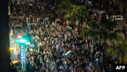 Moroccan protesters take part in a demonstration in solidarity with Palestinians following Al-Quds (Jerusalem) Day, a commemoration in support of Palestinian people on the last Friday of the Islamic holy fasting month of Ramadan, in the city of Casablanca early on April 6, 2024.