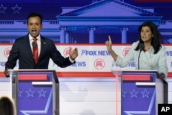 FILE - Businessman Vivek Ramaswamy, left, and former U.N. Ambassador Nikki Haley speak during a Republican presidential primary debate hosted by FOX News Channel, in Milwaukee, Wisconsin, Aug. 23, 2023. The two competed for the 2024 Republican presidential nomination.