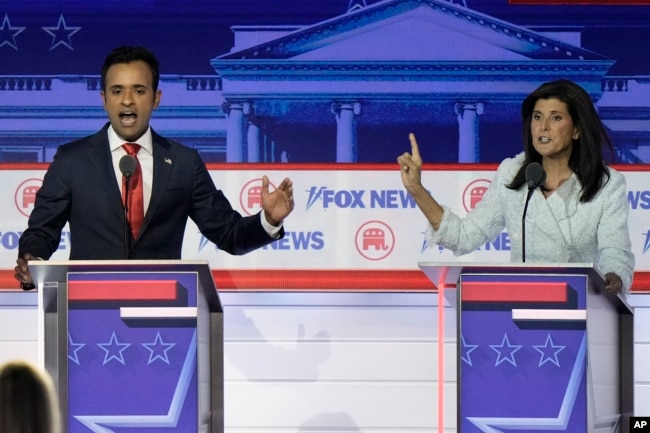 FILE - Businessman Vivek Ramaswamy, left, and former U.N. Ambassador Nikki Haley speak during a Republican presidential primary debate hosted by FOX News Channel, in Milwaukee, Wisconsin, Aug. 23, 2023. The two competed for the 2024 Republican presidential nomination.