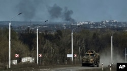 A Ukrainian APC seen on the road on the frontline in Bakhmut, Donetsk region, April 9, 2023.