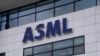 FILE - The logo of ASML hangs on the head office in Veldhoven, Netherlands, Jan. 30, 2023. The Dutch government announced Tuesday it is planning on imposing additional restrictions on the export of machines that make advanced processor chips.