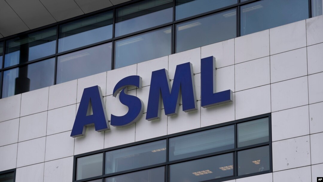 FILE - The logo of ASML hangs on the head office in Veldhoven, Netherlands, Jan. 30, 2023. The Dutch government announced Tuesday it is planning on imposing additional restrictions on the export of machines that make advanced processor chips.