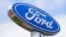 FILE - A Ford sign is shown at a dealership in Springfield, Pennsylvania., April 26, 2022.  Ford is recalling nearly 243,000 Maverick small pickup trucks in the U.S. because the tail lights may not illuminate.
