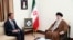 Iran's Supreme Leader Ayatollah Ali Khamenei, right, speaks with Syrian President Bashar Assad during their meeting in Tehran, May 30, 2024. A portrait of the late President Ebrahim Raisi is seen between them. (Office of the Iranian Supreme Leader via AP)