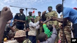 Mohamed Toumba, one of the soldiers who ousted Nigerian President Mohamed Bazoum, addresses supporters of Niger's ruling junta in Niamey, Aug. 6, 2023. 