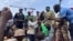 Mohamed Toumba, one of the soldiers who ousted Nigerian President Mohamed Bazoum, addresses supporters of Niger's ruling junta in Niamey, Aug. 6, 2023. 