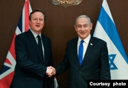 内塔尼亚胡总理与英国外交大臣卡梅伦 (以色列政府新闻办公室提供）