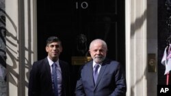 Britain's Prime Minister Rishi Sunak, left, greets Brazilian President Lula da Silva on the doorstep of 10 Downing Street, London, May 5, 2023.