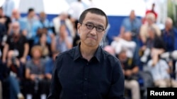 Director Lou Ye is pictured during a photo call for the film "An Unfinished Film," presented as part of Special Screenings at the 77th Cannes Film Festival in Cannes, France, May 17, 2024.