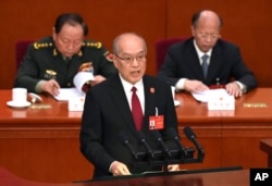 中国最高人民法院院长张军在北京人大会堂举行的全国人大会议上发表工作报告。（2024年3月8日）