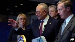 U.S. Senate Majority Leader Chuck Schumer, center, gestures as he speaks during a news conference at the U.S. Embassy after meeting with Chinese President Xi Jinping and Chinese officials in Beijing, Oct. 9, 2023.