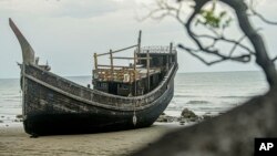 The boat used to carry a group of Rohingya Muslims sits on the beach where it landed on Dec. 10 in Pidie, Aceh province, Indonesia, Dec. 16, 2023.