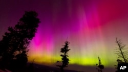 The northern lights fill the sky at the Bogus Basin ski resort in Boise, Idaho, May 11, 2024.