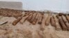 This photo released by the Cambodia Mine Action Center, CMAC, shows unexploded ordnance at Queen Kosamak High School in Kratie Province, northeastern of Phnom Penh, Cambodia, Sunday, Aug. 13, 2023. (Cambodia Mine Action Center via AP)