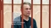 In this photo released by Basmanny District Court press service, Russian journalist Konstantin Gabov attends a hearing at a court in Moscow, April 27, 2024, after his arrest on extremism charges, which he denied. 