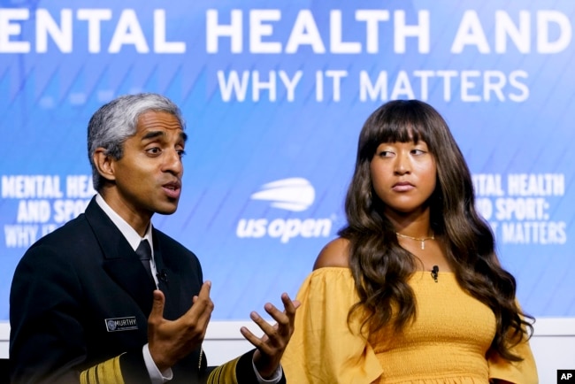 FILE - U.S. Surgeon General Vivek Murthy, left, speaks during a forum on mental health with Naomi Osaka during the U.S. Open tennis championships on Sept. 6, 2023, in New York. (AP Photo/Mary Altaffer)