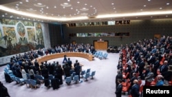 Representatives observe a minute of silence during a meeting at the United Nations Security Council, to mark one year since Russia invaded Ukraine, at U.N. headquarters in New York, Feb. 24, 2023.