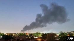 FILE: Smoke billows in Khartoum, Sudan amid ongoing fighting between the forces of two rival generals on May 6, 2023.