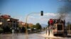 People are evacuated by a Caterpillar excavator from a flooded area in Larissa, central Greece, Sept. 11, 2023. 