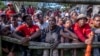 FILE - Economic Freedom Fighters protest in front of the presidential Guest House in Pretoria, South Africa, March 20, 2023, during a national shutdown called by their party.