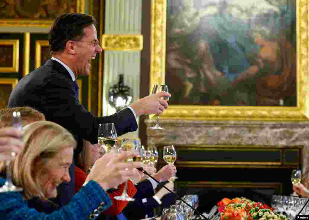 Dutch Prime Minister Mark Rutte makes a toast with South Korean President Yoon Suk Yeol (not pictured) during his visit to the Netherlands in The Hague, Netherlands.