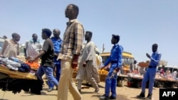 Sudanese police patrol the main market of Wad Madani, 200 km south of Khartoum, on June 24, 2023.