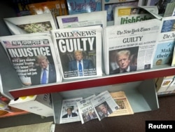 A news stand shows off headlines following the announcement of the verdict on former U.S. President Donald Trump's criminal trial, in Nyack, New York, May 31, 2024.