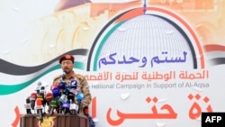 Huthi military spokesman Brigadier Yahya Saree delivers a statement on the recent attacks against two commercial vessels in the Red Sea during a march in solidarity with the people of Gaza in the Yemeni capital of Sanaa on Dec. 15, 2023.