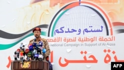 Houthi military spokesman Brigadier Yahya Saree delivers a statement on attacks against commercial vessels in the Red Sea during a march in solidarity with the people of Gaza in the Yemeni capital of Sanaa on Dec. 15, 2023.