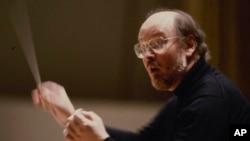 FILE - Boston Pops Conductor John Williams conducting the orchestra in Boston in 1980.