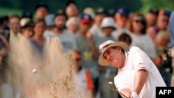 FILE - South African golfer John Bland shoots out of a trap at the U.S. Senior Open golf Championship at Olympia Fields Country Club in Olympia Fields, IL. on June, 29 1997.