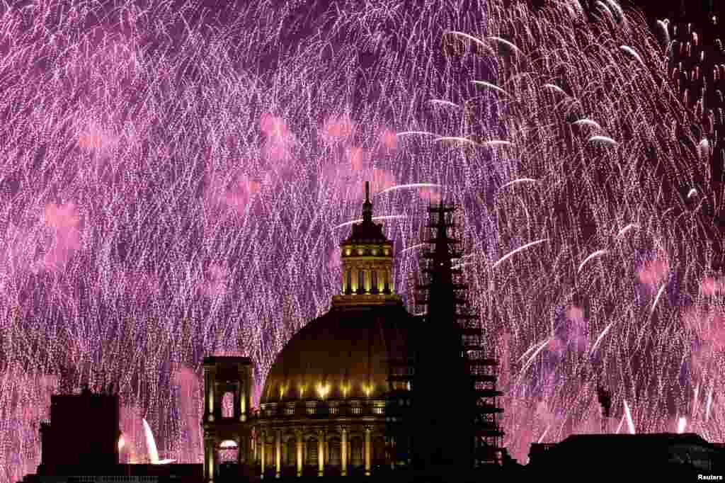 Fireworks explode behind the steeple of St. Paul&#39;s Anglican Pro-Cathedral and the dome of the Basilica of Our Lady of Mount Carmel during the Malta International Fireworks Festival in Valletta, Malta, April 30, 2023.