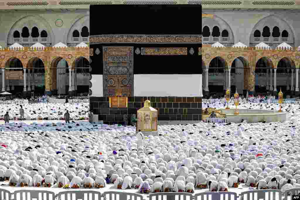 Muslim worshipers pray around the Kaaba, Islam&#39;s holiest shrine, at the Grand Mosque in Saudi Arabia&#39;s holy city of Mecca as pilgrims arrive ahead of the annual hajj pilgrimage.