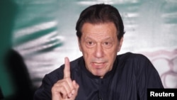 FILE - Pakistan's former Prime Minister Imran Khan, gestures as he speaks to the members of the media at his residence in Lahore, Pakistan, May 18, 2023.