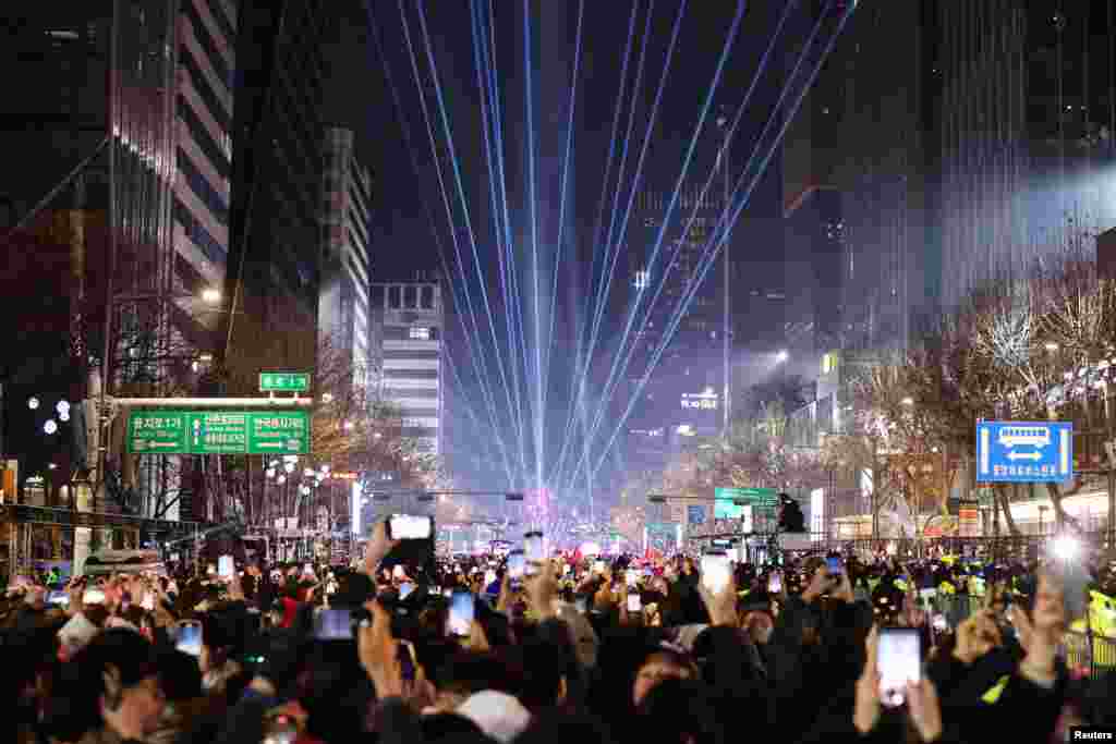 People celebrate the New Year in Seoul, South Korea, Jan. 1, 2024.