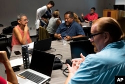 Fiore hosts a faculty teaching circle on artificial intelligence on Aug. 9, 2023, at Temple University in Philadelphia. Educators say they want to embrace the technology’s potential to teach and learn in new ways, but when it comes to assessing students, they see a need to “ChatGPT-proof” test questions and assignments. (AP Photo/Joe Lamberti)