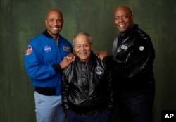 NASA astronauts Victor Glover, from left, Ed Dwight and Leland Melvin pose for a portrait to promote the National Geographic documentary film "The Space Race" during the Winter Television Critics Association Press Tour, Feb. 8, 2024. (AP Photo/Chris Pizzello)