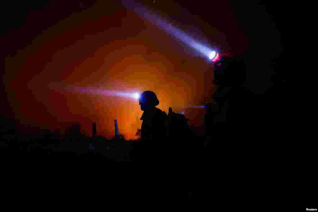 Members of Brazilian Institute for the Environment and Renewable Natural Resources fire brigade work to extinguish a fire rising in Amazon rainforest in Apui, Amazonas state, Brazil, Aug. 8, 2024