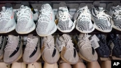 FILE - Yeezy shoes made by Adidas are displayed at Laced Up, a sneaker resale store, in Paramus, New Jersey, on Oct. 25, 2022.