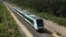 The inaugural train with President Andrés Manuel López Obrador on board passes near Chochola, Quintana Roo State, Mexico, Dec. 15, 2023. 