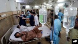 Heatstroke patients receive treatment at a hospital in Karachi, Pakistan, July 25, 2024.