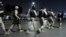Paramilitary soldiers arrive at the incident site following an attack by gunmen on police headquarters in Karachi, Pakistan, Feb. 17, 2023. Militants launched a brazen attack on the police headquarters of Pakistan's largest city on Friday, officials said. 