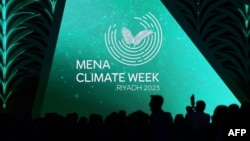 Delegates and journalists attend the opening session of the Middle East and North Africa (MENA) Climate Week, a U.N.-organized conference hosted in the Saudi capital Riyadh, Oct. 8, 2023.
