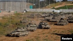 Israeli tanks maneuver on their way to Gaza near the Israel-Gaza border, in Israel, April 10, 2024.
