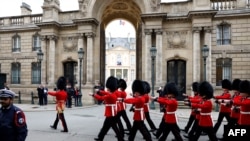 British members of Number 7 Company Coldstream Guards march along the street outside the Elysee Palace, as they make their way into the courtyard, in Paris, France, April 8, 2024. 