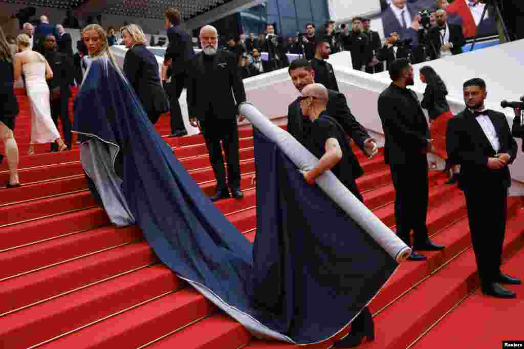 Bilal Hassani poses on the red carpet during arrivals for the screening of the film &quot;The Apprentice&quot; in competition at the 77th Cannes Film Festival in Cannes, France.