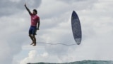 Brazil's Gabriel Medina reacts after getting a large wave in the 5th heat of the men's surfing round 3, during the Paris 2024 Olympic Games, in Teahupo'o, on the French Polynesian Island of Tahiti, July 29, 2024. 