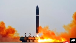 This photo provided by the North Korean government, shows what it says a test launch of a Hwasong-15 intercontinental ballistic missile at Pyongyang International Airport in Pyongyang, North Korea, Feb. 18, 2023.